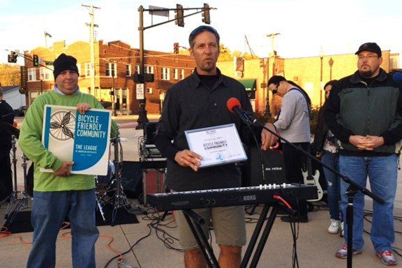 Paul Wojciechowski presents Bicycle Friendly Community Award to Ferguson officia