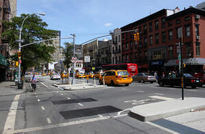 8th Ave Bike Lane in NYC.  Photo credit: Bossi on FlickR, http://www.flickr.com/