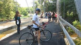At the ribbon cutting for the re-opening of the Riverside Bridge